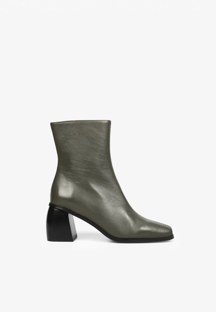 "ScalpersCompany Women's Stylish High Heel Ankle Boots with Seam Detailing for Fashionable Outfits"