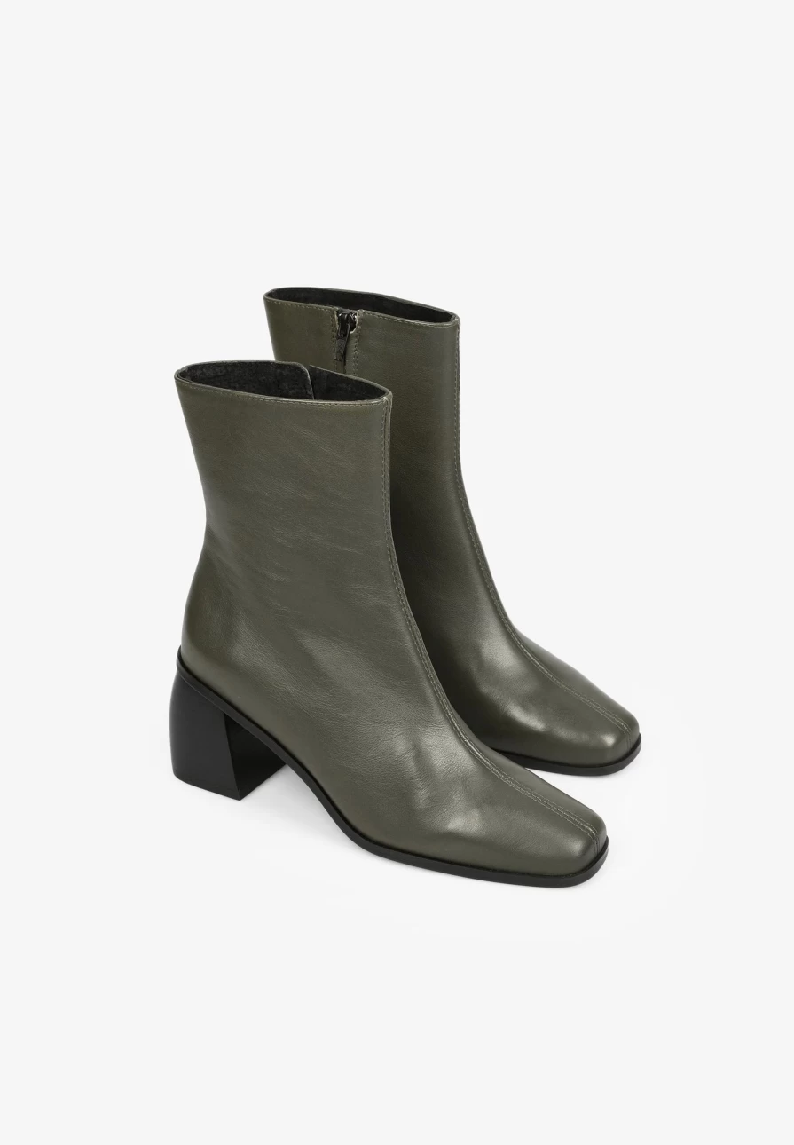 "ScalpersCompany Women's Stylish High Heel Ankle Boots with Seam Detailing for Fashionable Outfits"