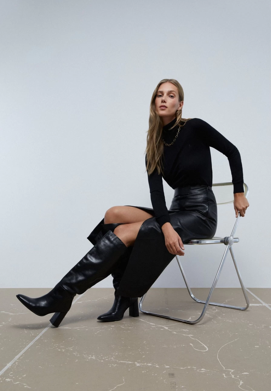 "ScalpersCompany Women's Black Knee-High Leather Boots | Stylish & Comfortable"
