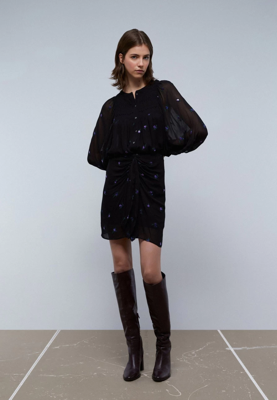 "ScalpersCompany Women's Black Mini Skirt with Knot Detail and Floral Design"