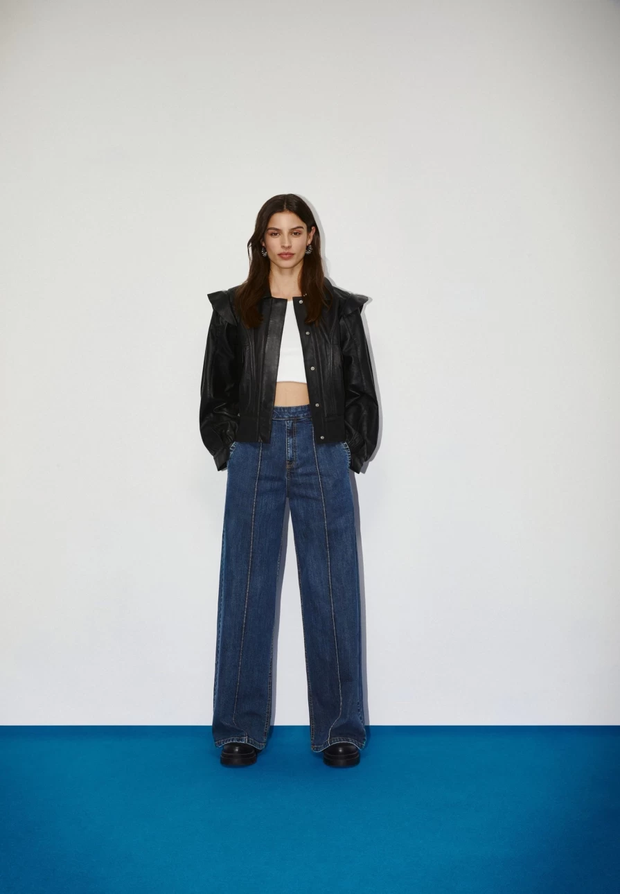 "ScalpersCompany Women's Stylish Leather Jacket with Elegant Shoulder Frill Detail"
